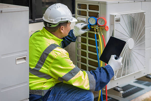 Professional Hvac technician working in Baldwin Place, NY